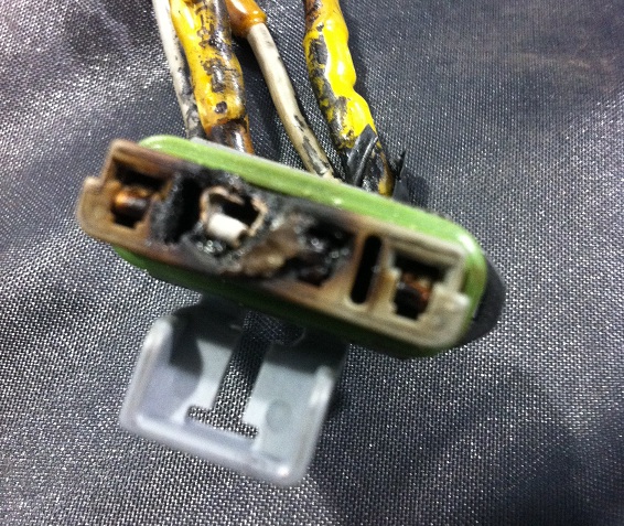 Picture of burned blower motor resistor connector. This will cause a few of the speeds to not work when you turn on the heater or air conditioner in your car or truck. There is a recall on these parts for many GM trucks.